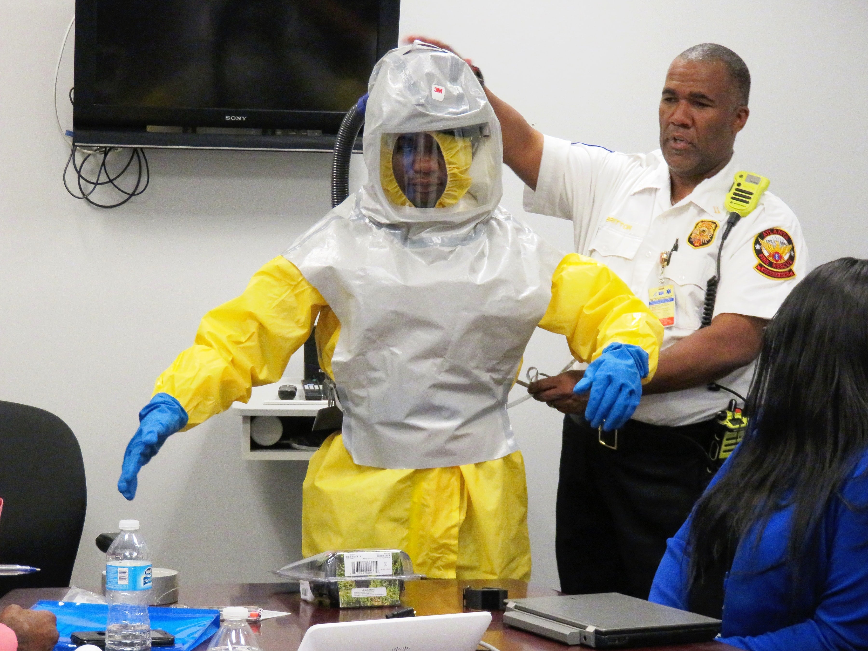 EMS workers donning PPE