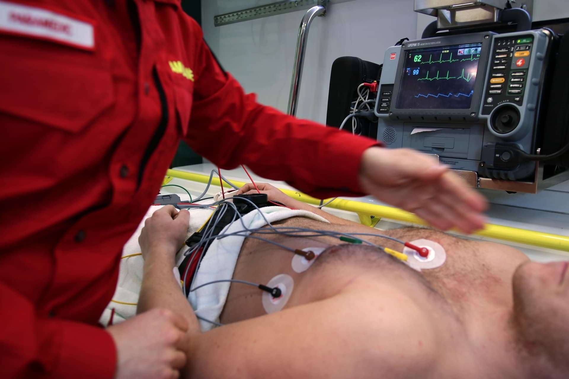 Paramedic assisting a patient