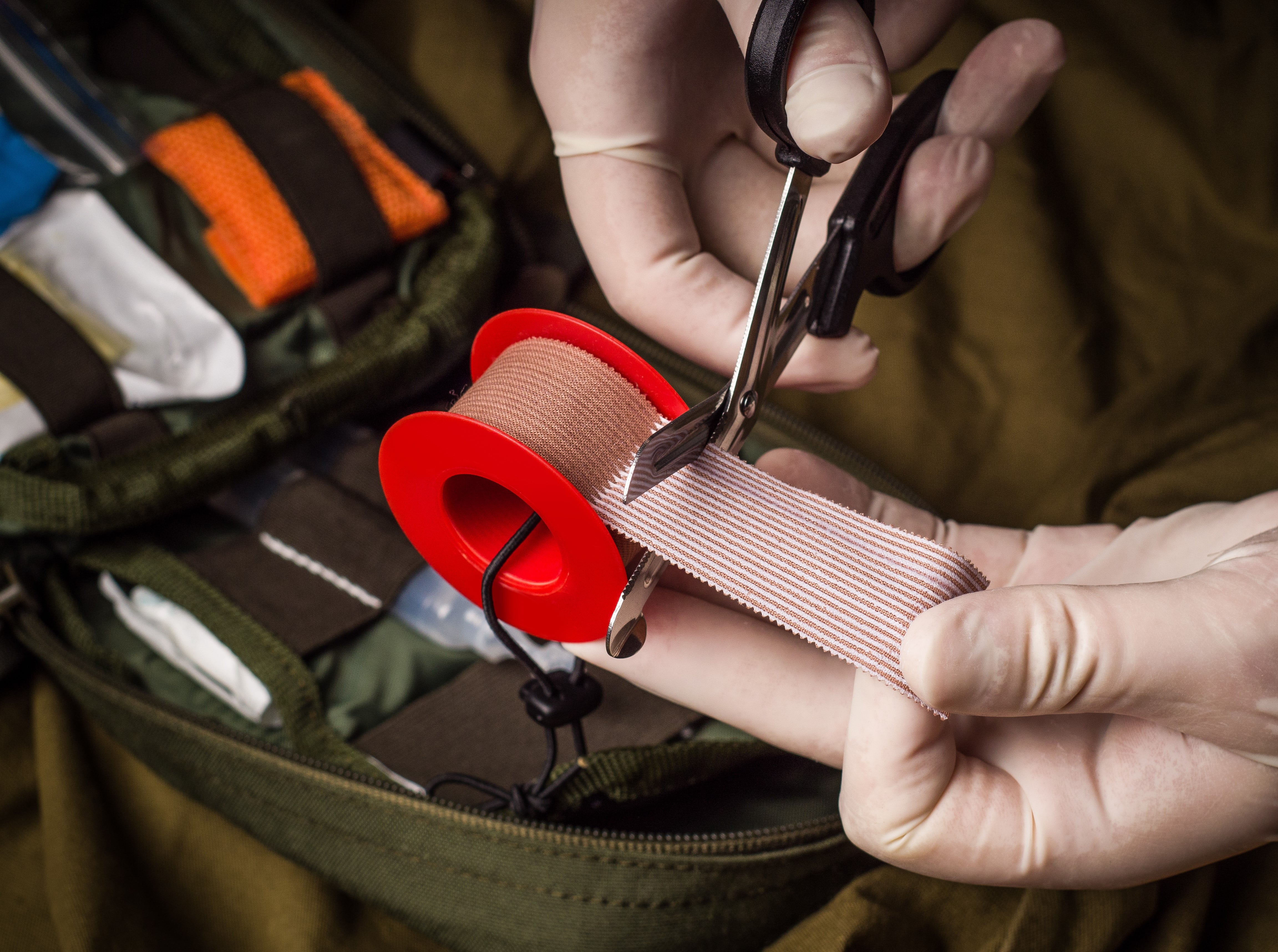 Medical professional using Trauma Shears